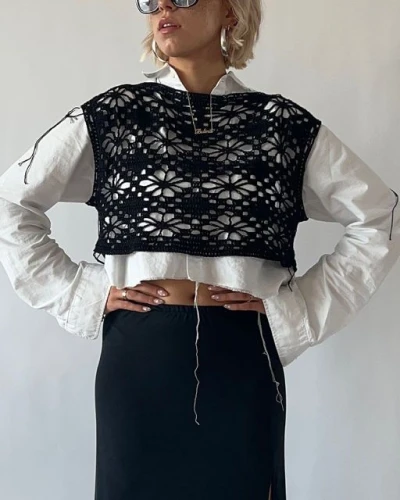 Black floral crochet top with short sleeves and floral motif pattern.