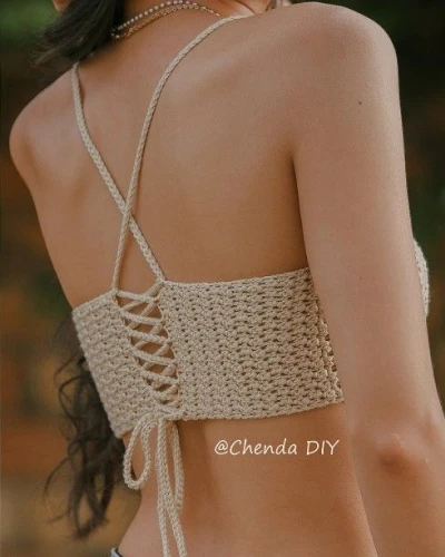 Back view of crochet V-neck bandana top showing tied straps and open crochet pattern.