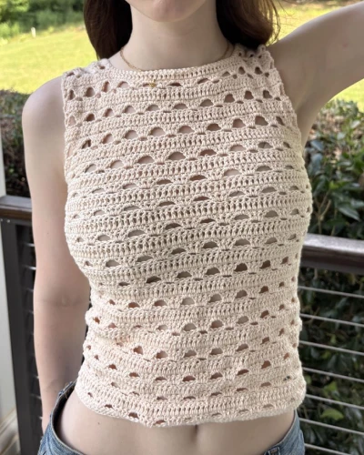 Front view of crochet arched tank top showing breathable texture and flattering silhouette.