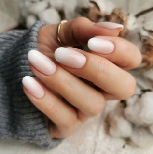 Gel polish nails being refreshed during a nail fill with a new gel color