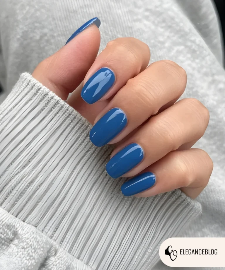 Short to medium stormy blue nails with glossy finish for winter