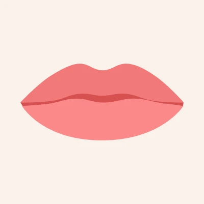Wide lips that extend noticeably across the face