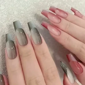 woman showing new trend french double ombre coffin nails design